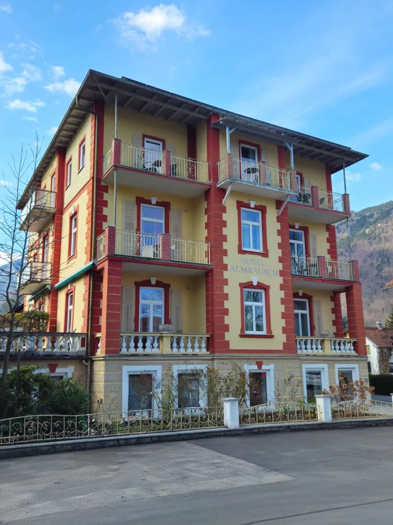 Exterior view of Hotel Almrausch in Bad Reichenhall – historic Art Nouveau building with balconies and mountain panorama