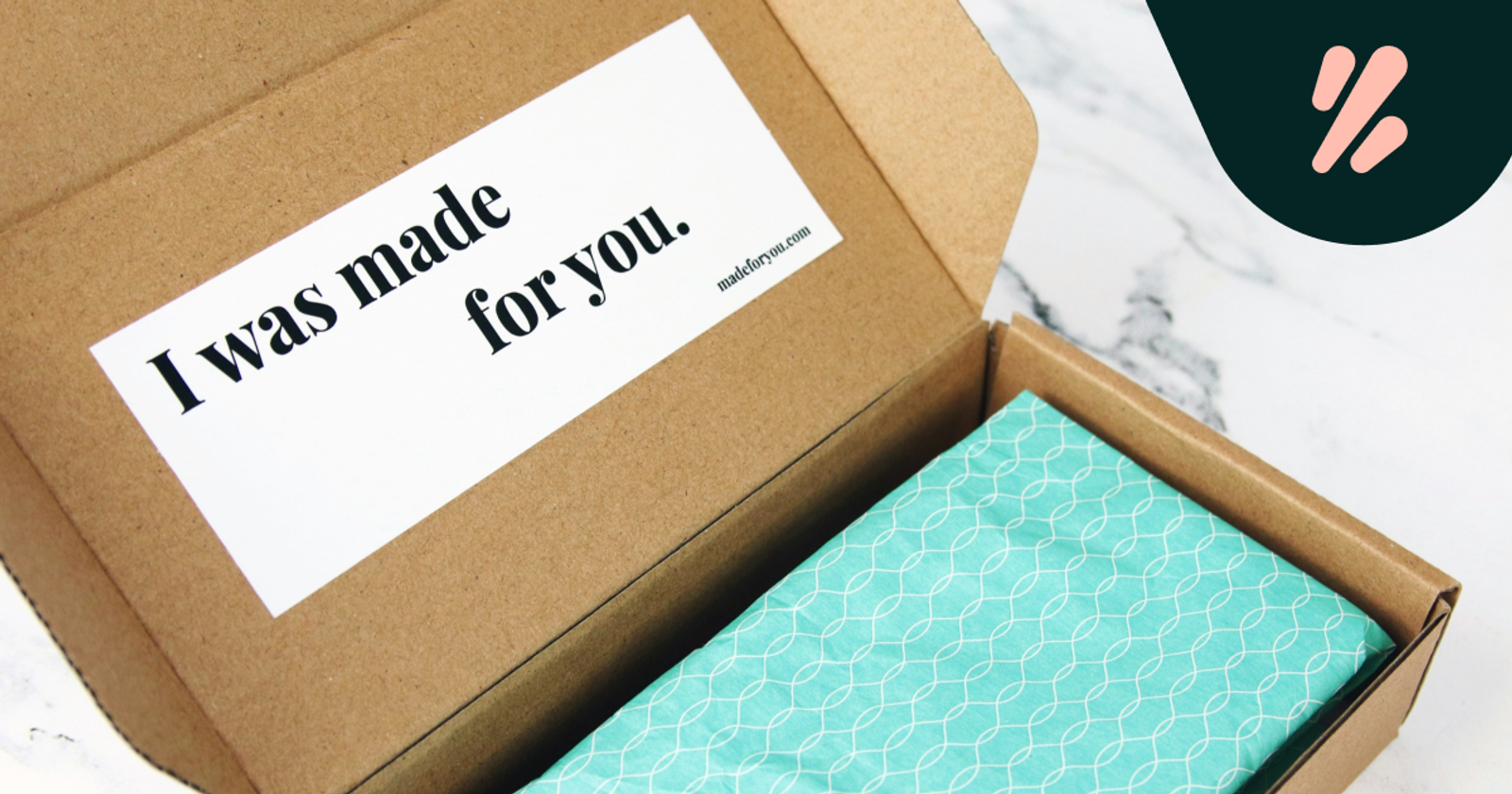 Hands opening a beautifully packaged box revealing a premium product inside