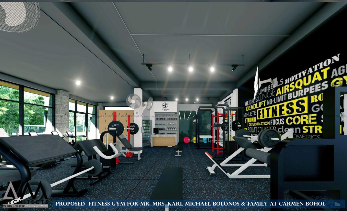 Interior of a fitness gym with weights area and graphic wall in Carmen
