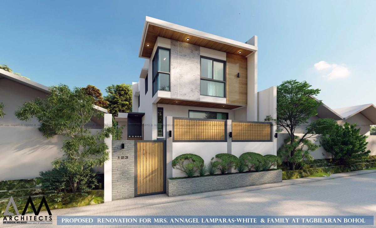 Renovated two-storey home with timber gate and screens in Tagbilaran City