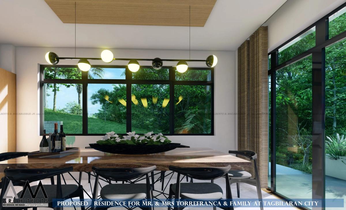 Dining area with a timber slab table and garden views