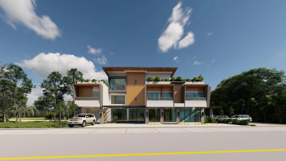 Front elevation of a two-storey commercial building with planted roof deck in Carmen