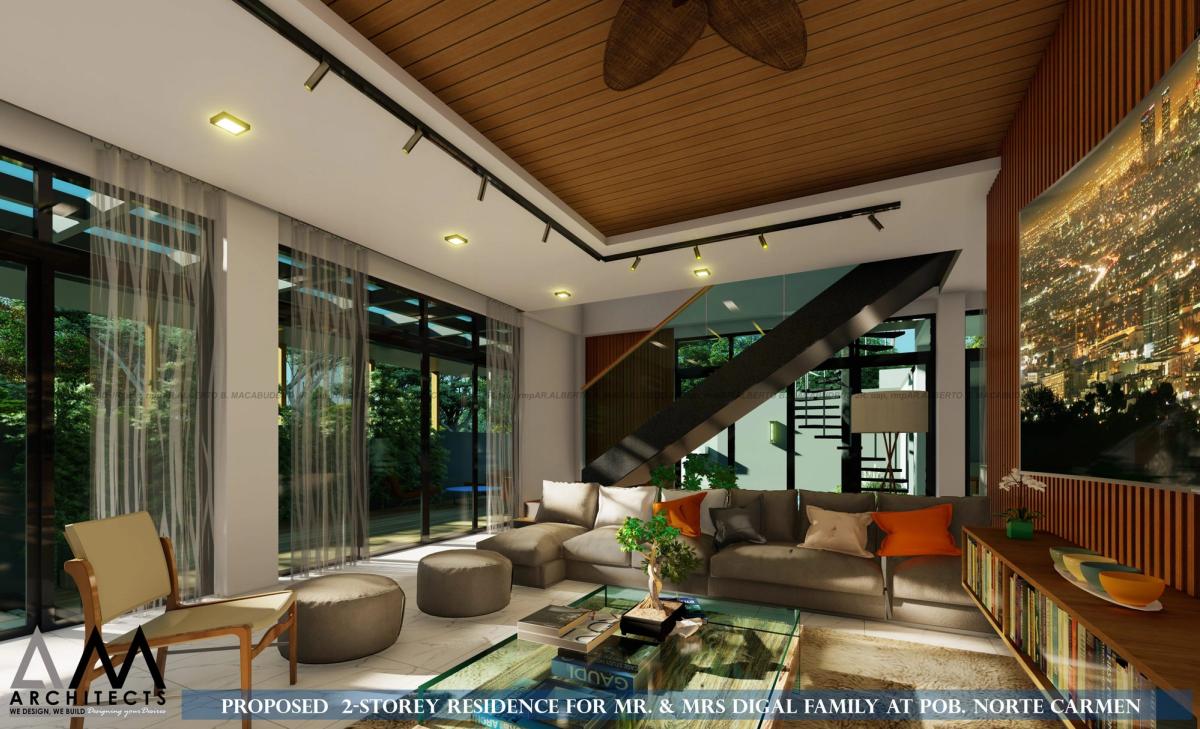 Living area and staircase behind floor-to-ceiling glazing