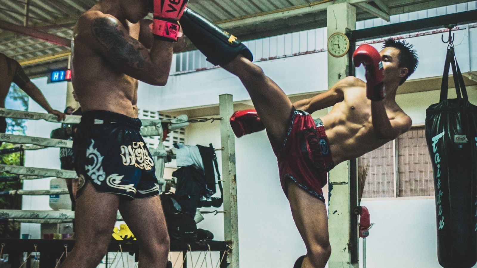A fighter shadow-boxing in an empty gym