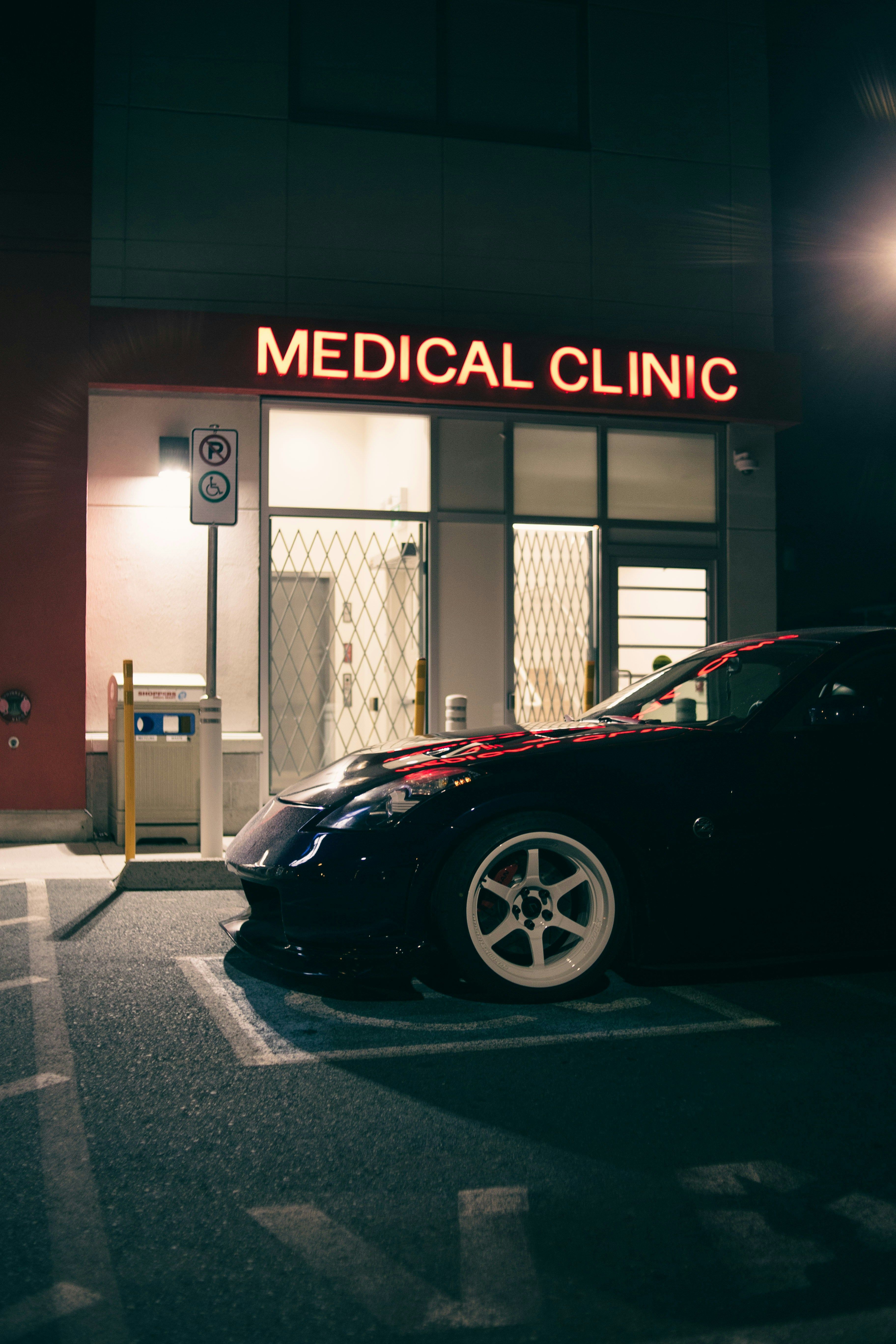 A car is parked in front of a medical clinic