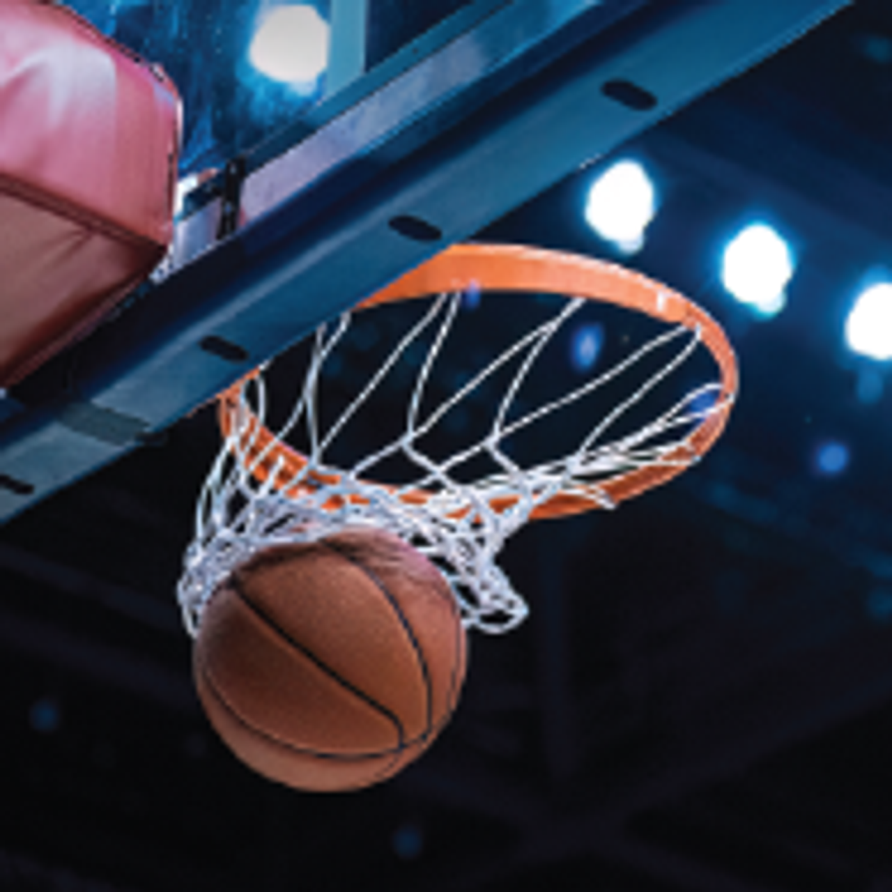 Basketball swishing through a basketball hoop