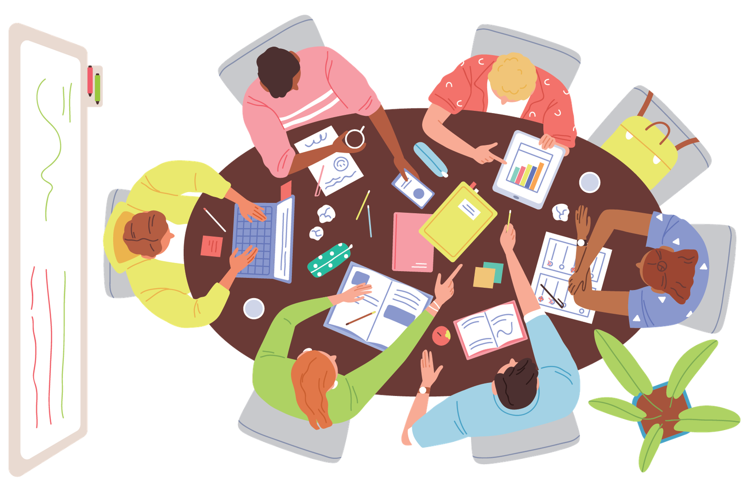 Overhead view of people working together at a table analyzing data and collaborating