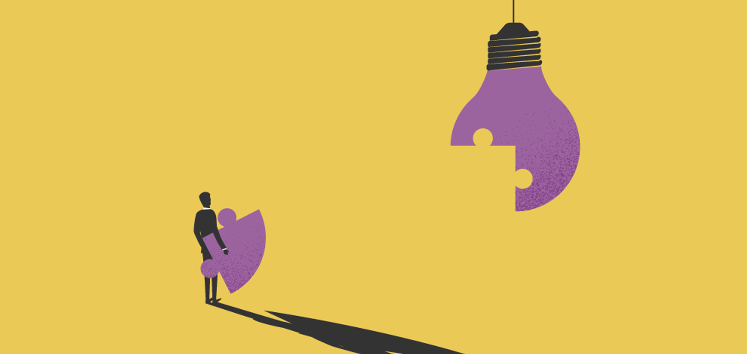 A Person holding a puzzle-piece to a lightbulb image