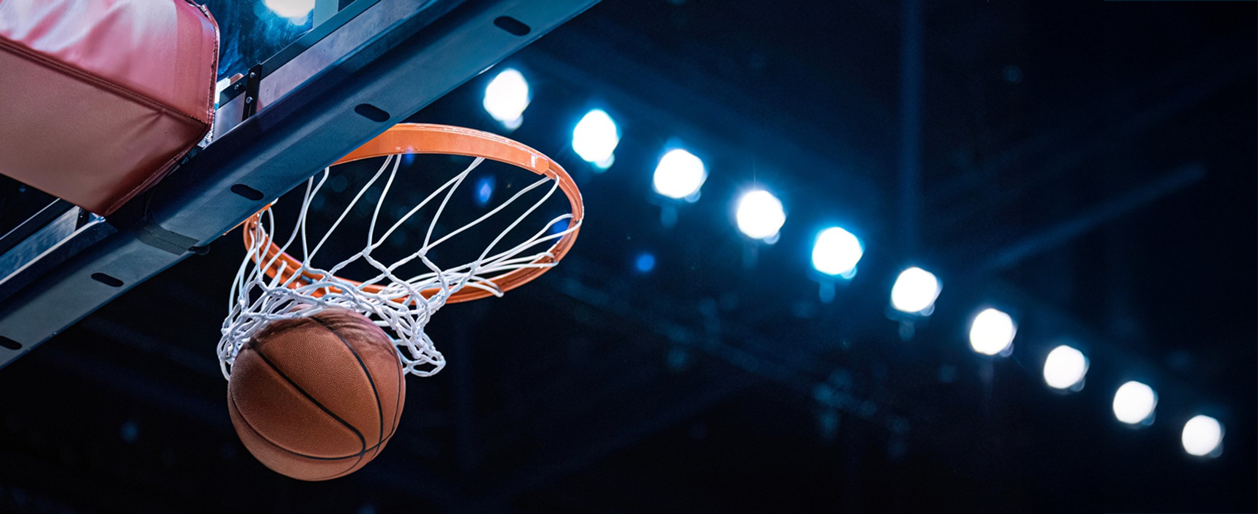 Basketball swishing through a basketball hoop
