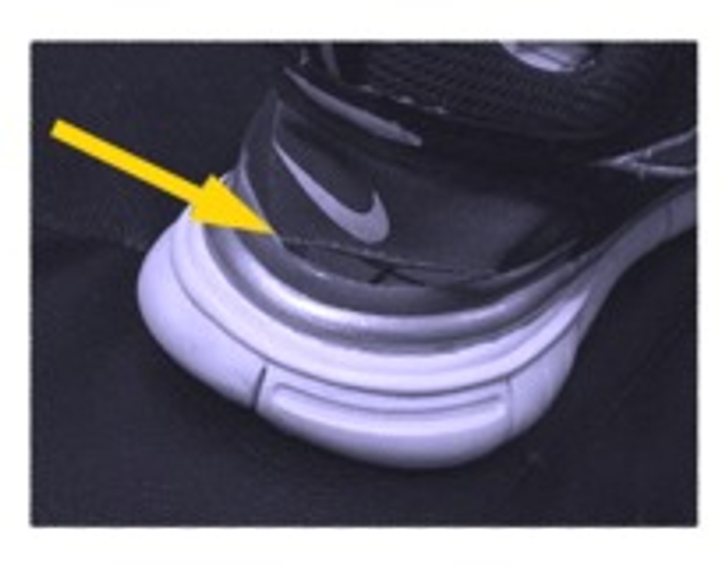 A tear in the heel of a new Nike shoe