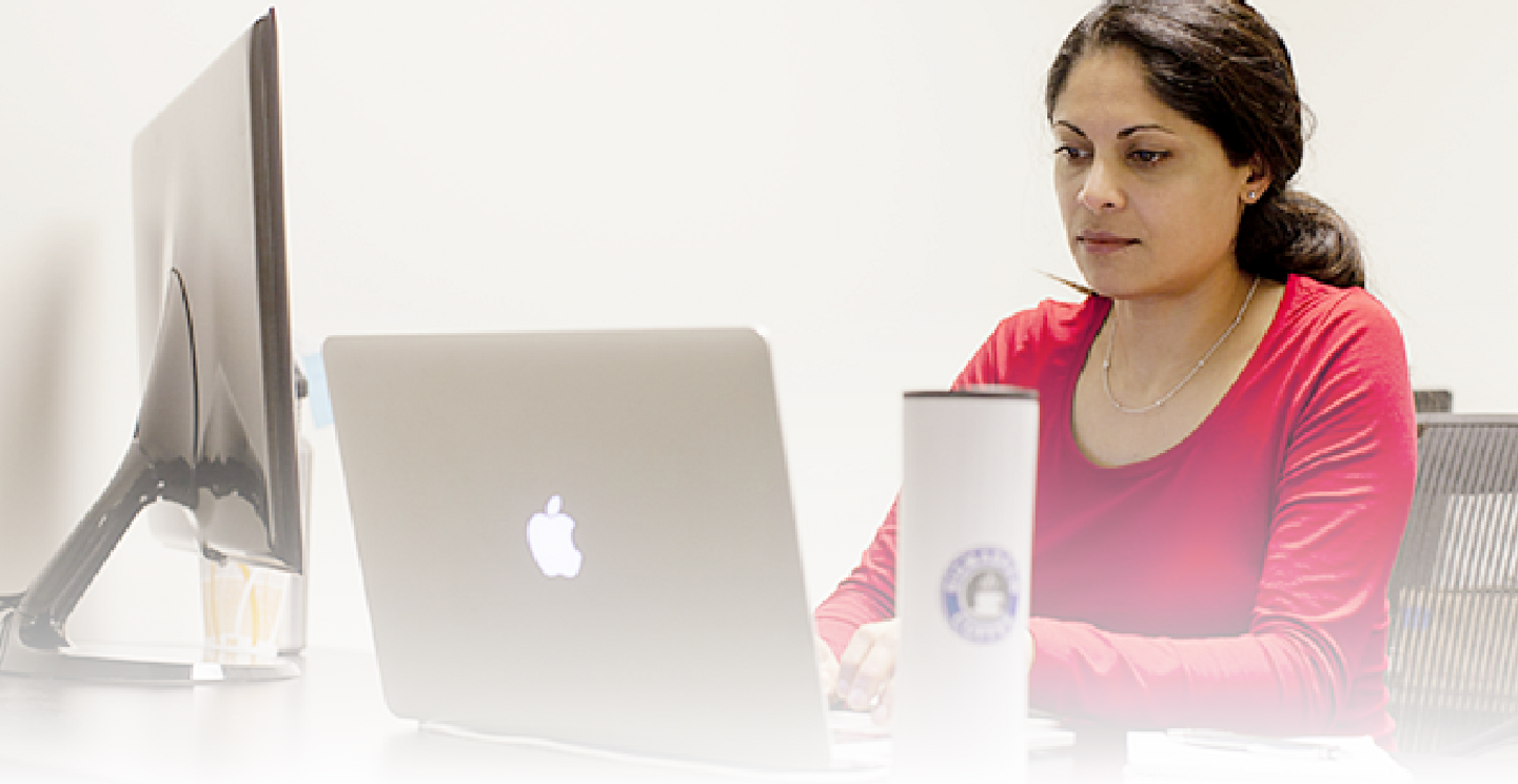 A woman studying on her laptop