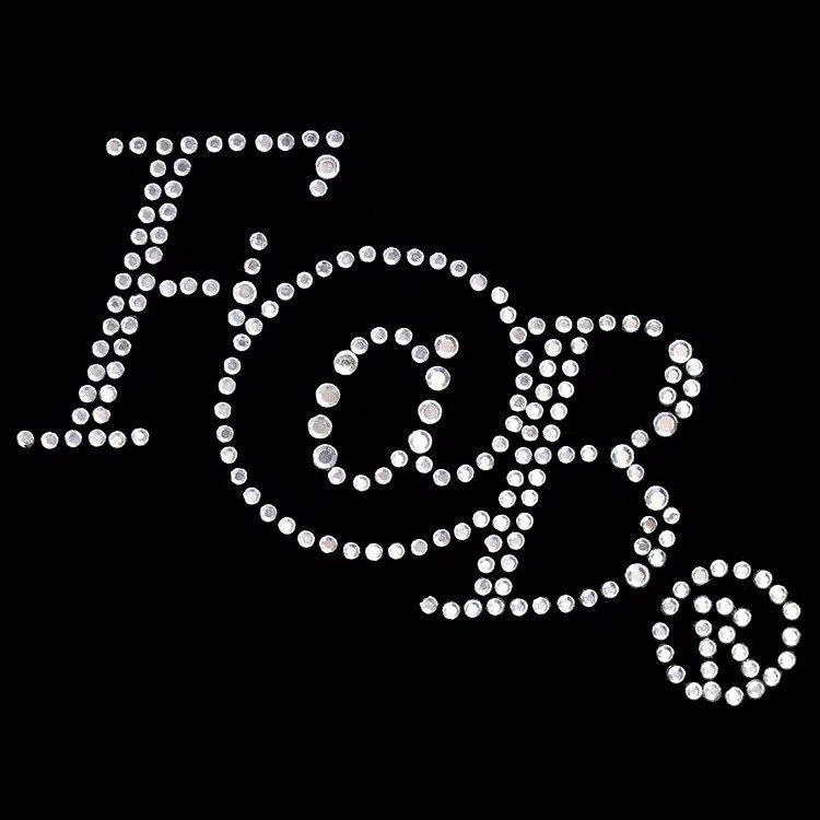 A monogram in clear rhinestones, a StudStone heat transfer