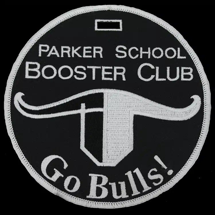 Round black embroidered luggage tag for Parker School Booster Club with a white longhorn and Go Bulls lettering, and a strap slot at the top.