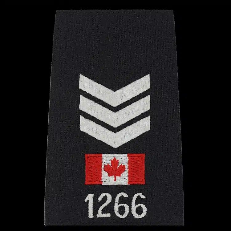 Black epaulet cover embroidered with three white chevrons, a small red and white flag and a white number.