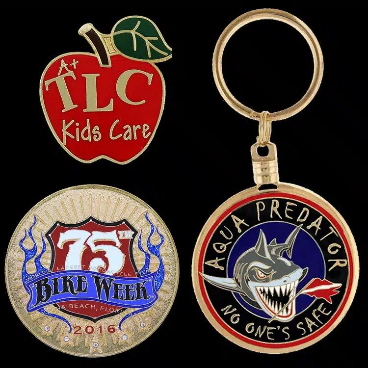 Category tile of assorted custom challenge coins and enamel pieces, including a shark design, an anniversary coin and a coin on a keyring