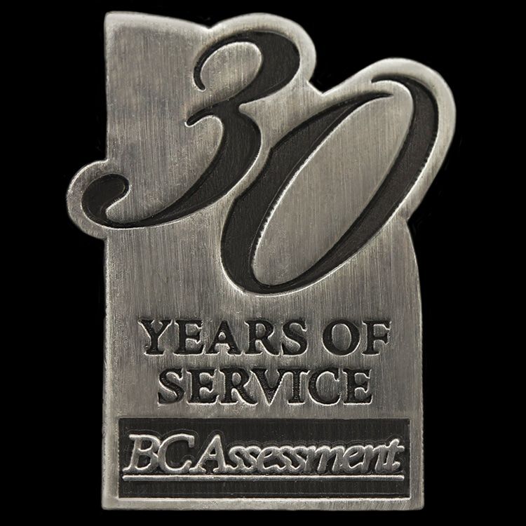 Antique silver die struck lapel pin without enamel, marking a service anniversary design.