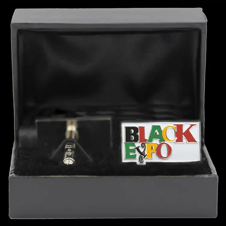 Enamel cuff links in a black presentation box.