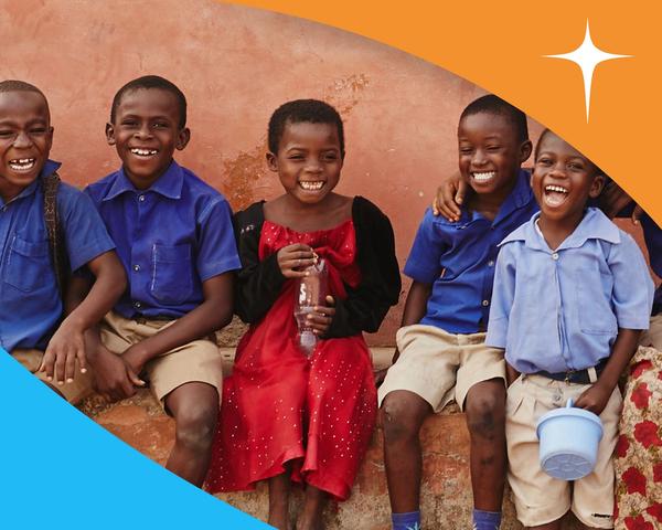 Image of smiling children with the World Vision's logo