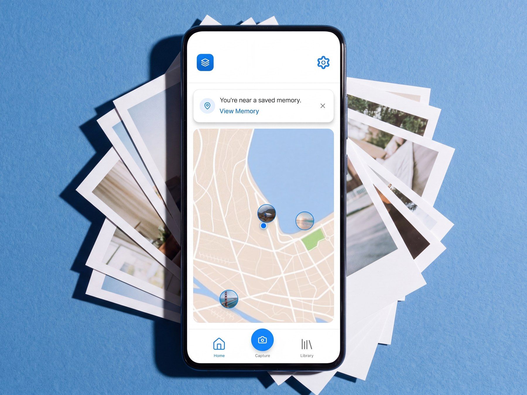 The phone on a stack of prints