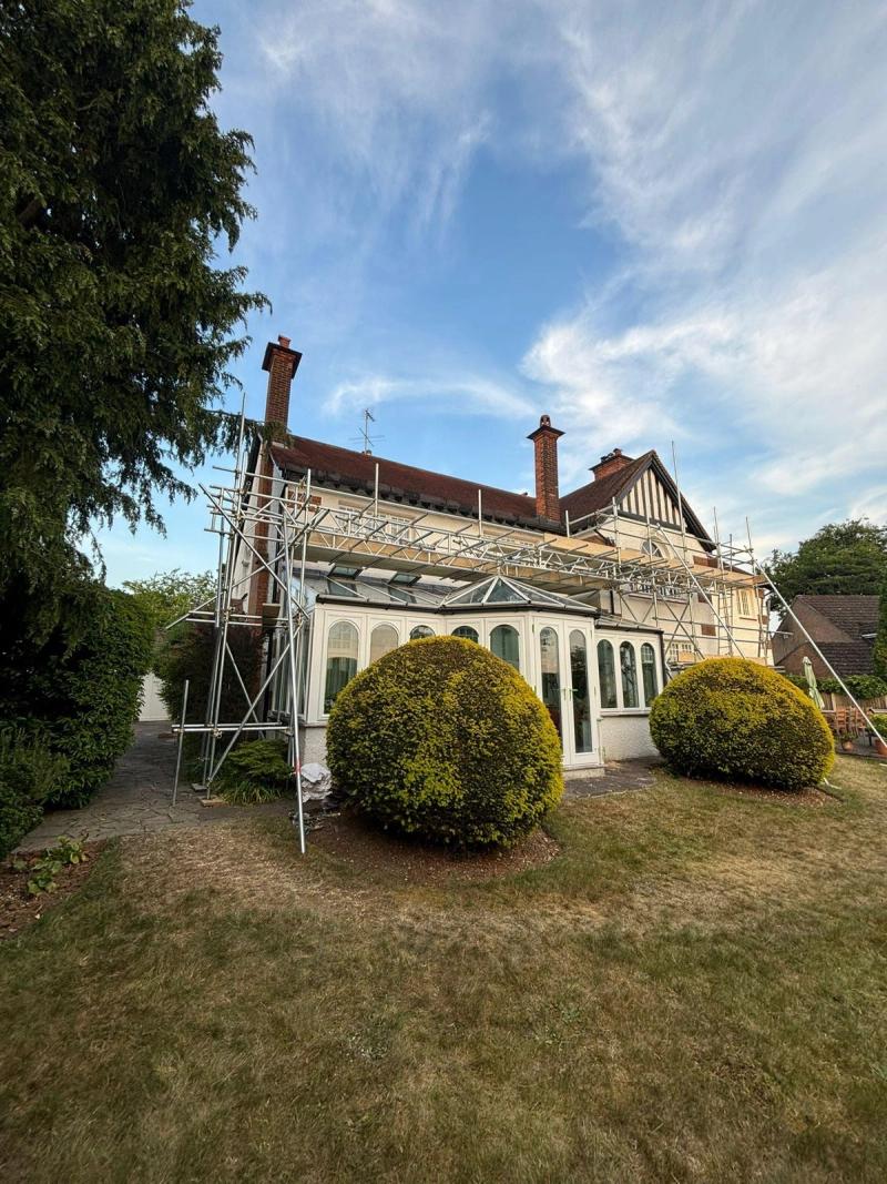 Scaffolding on a period house with a conservatory
