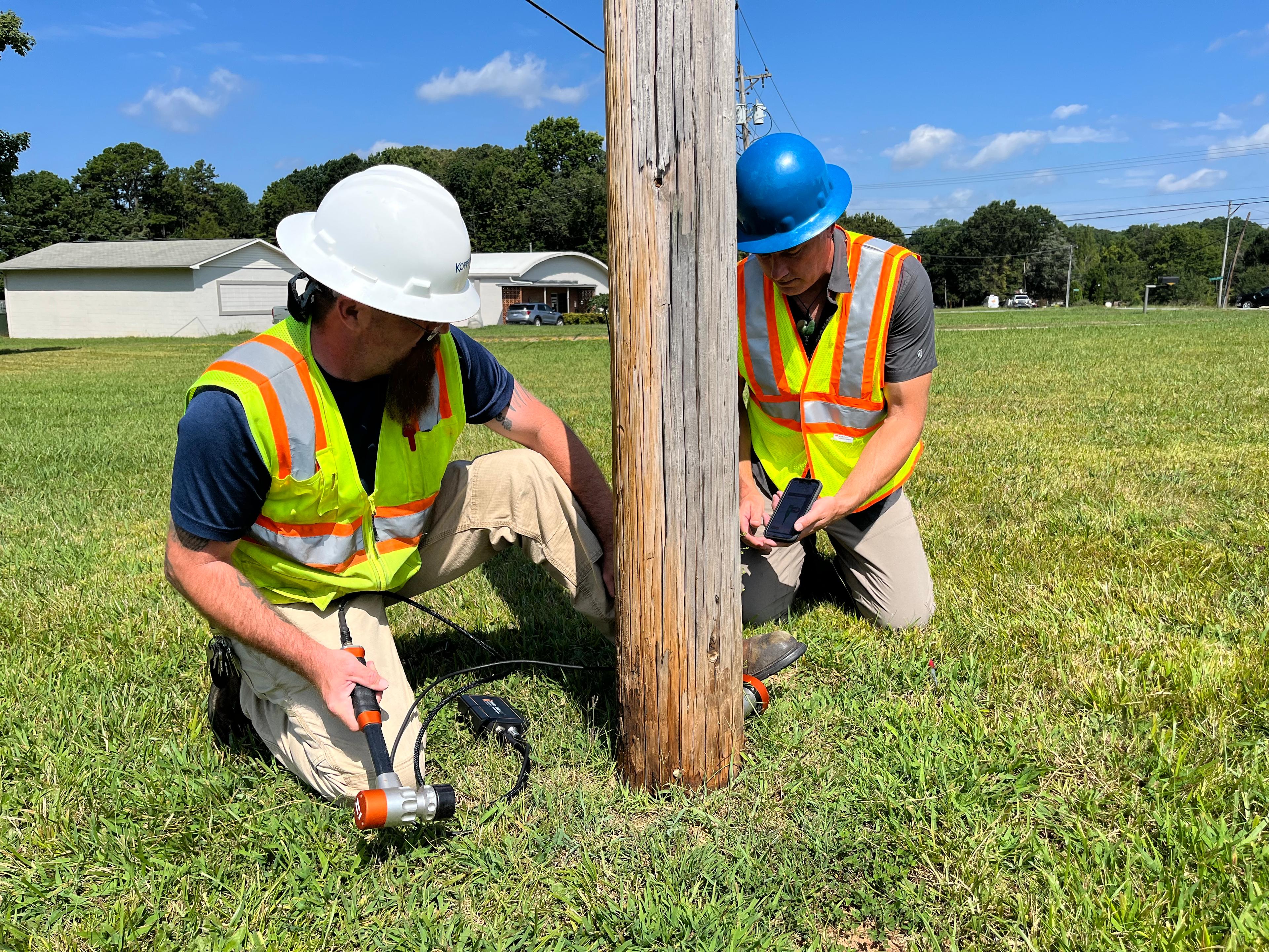 Koppers employee treating utility poles