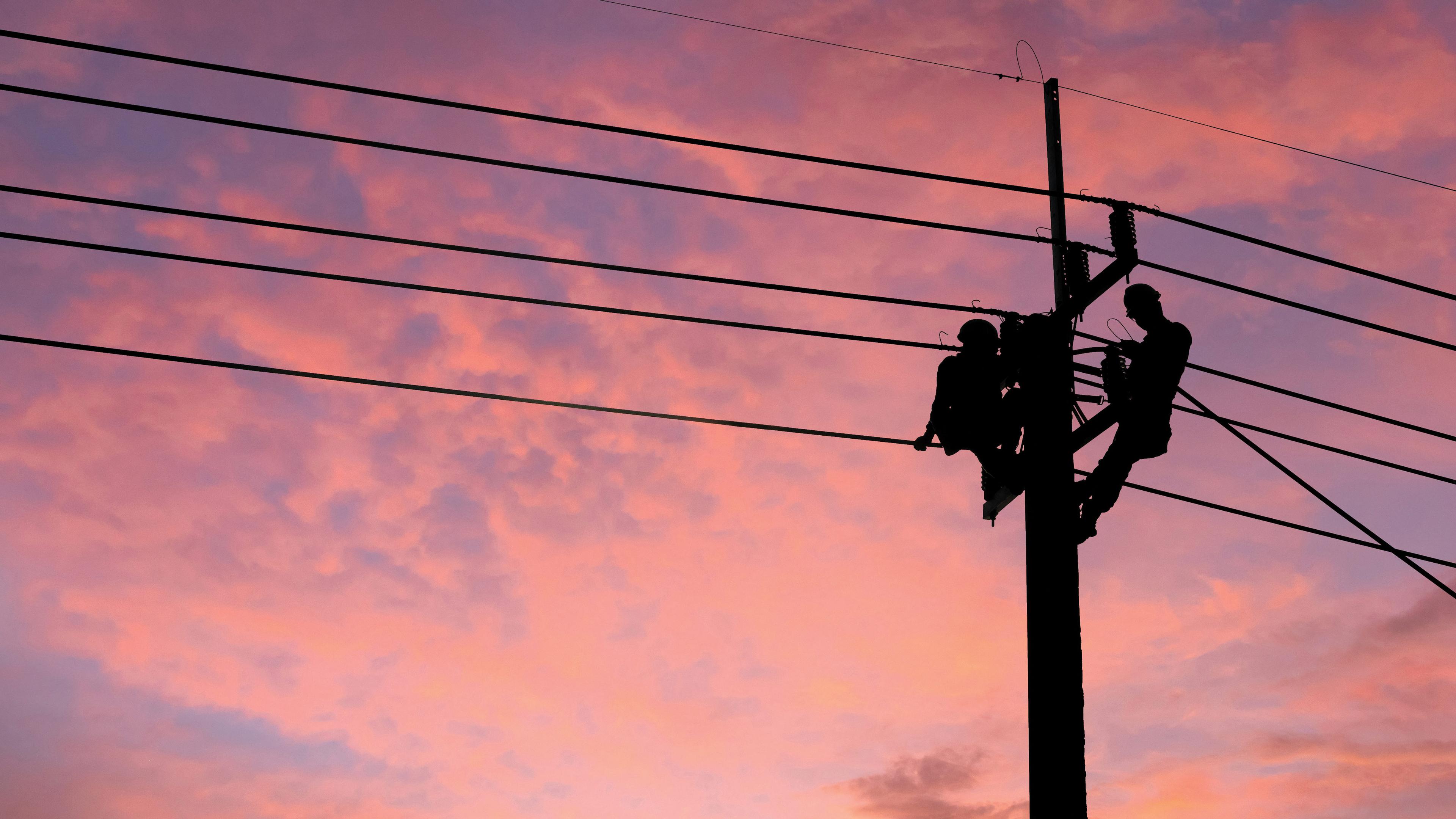 Two workers on a utility pole