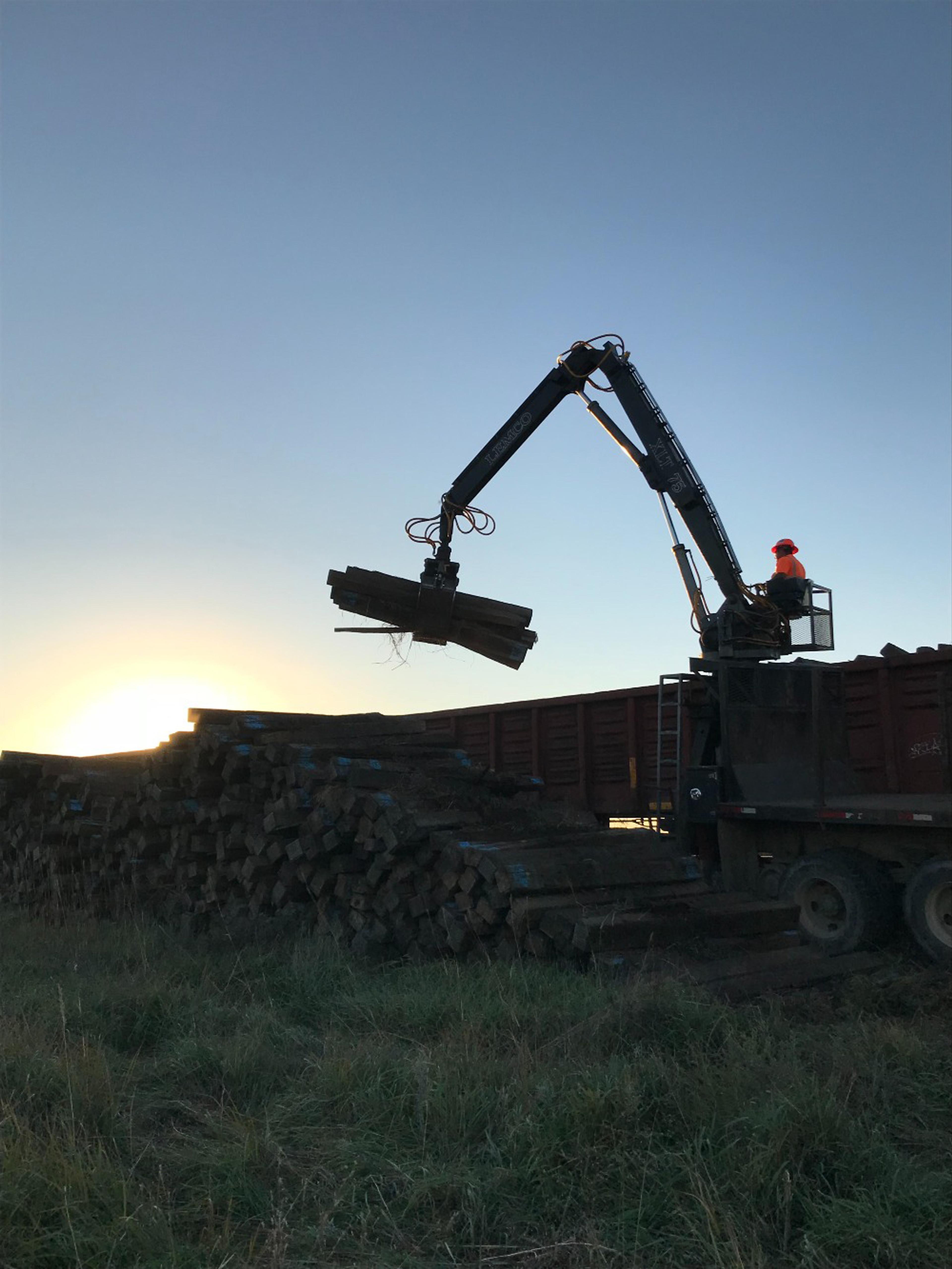 Crane moving wood
