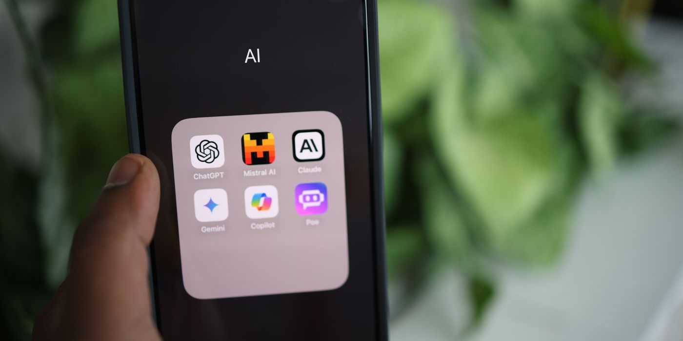 Phone open on a folder of AI apps: ChatGPT, Mistral AI, Claude, Gemini, Copilot and Poe