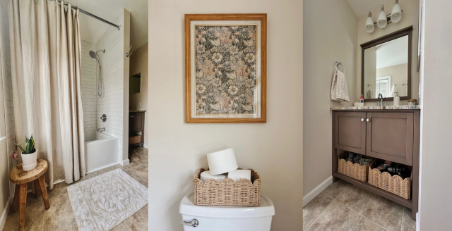 Refreshed family bathroom with white shower tile, a wood vanity and framed floral art