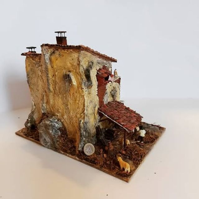 Casale su roccia con cantina a vista e piccole botti