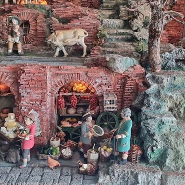 Dettaglio del presepe con bue sul terrazzamento e bottega di frutta e verdura sottostante