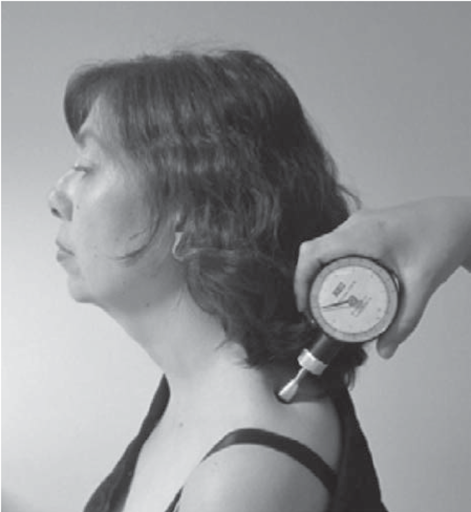 Pressure pain threshold test on upper trapezius muscle using algometer to assess pain sensitivity.