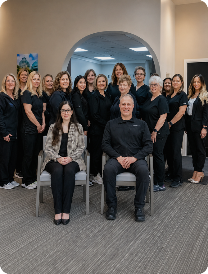 The Dearborn West Dental team photographed together in the clinic