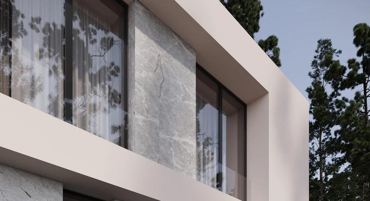 A marble-look wall panel on the exterior of a modern building