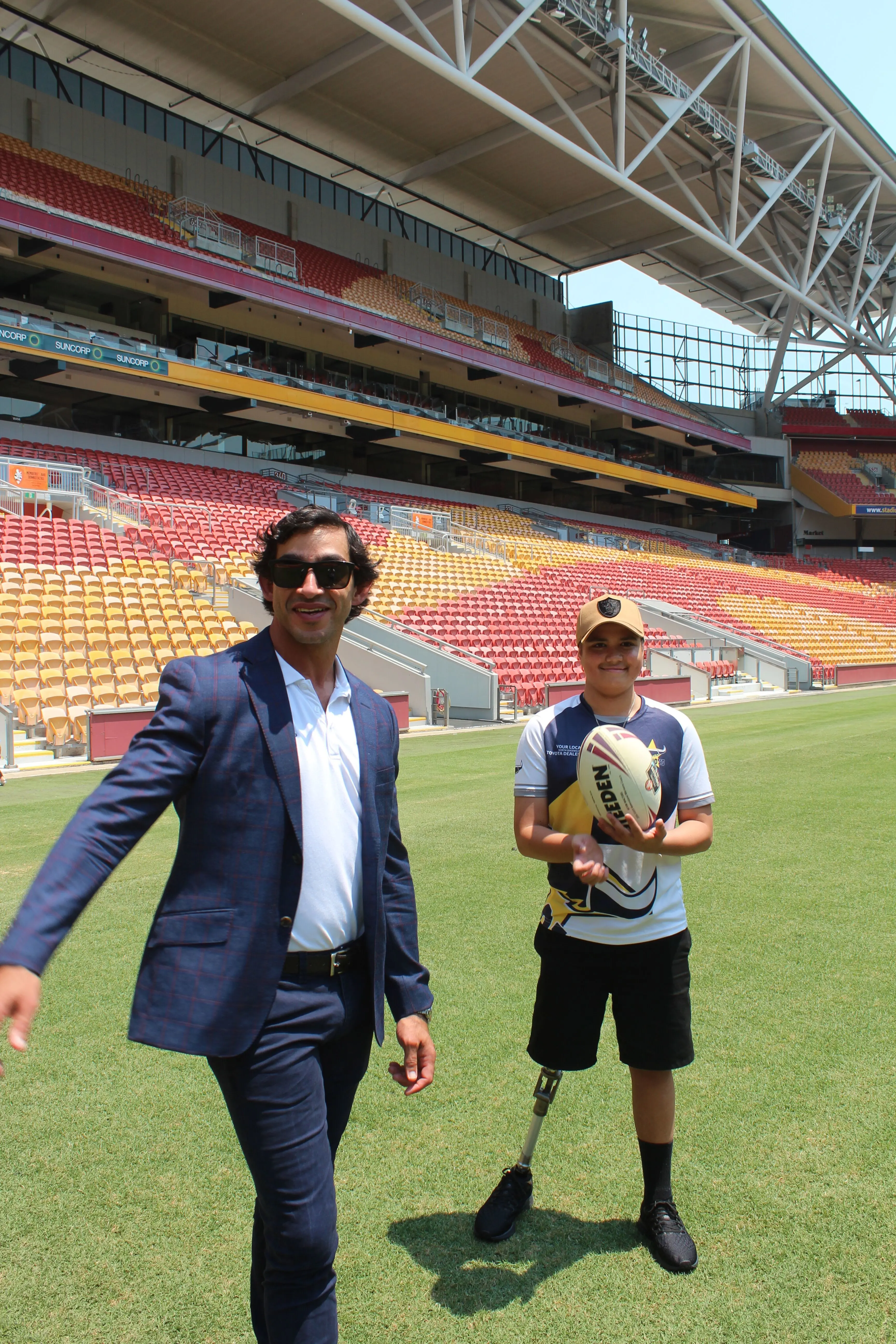 Brodi and Johnathan Thurston playing ball