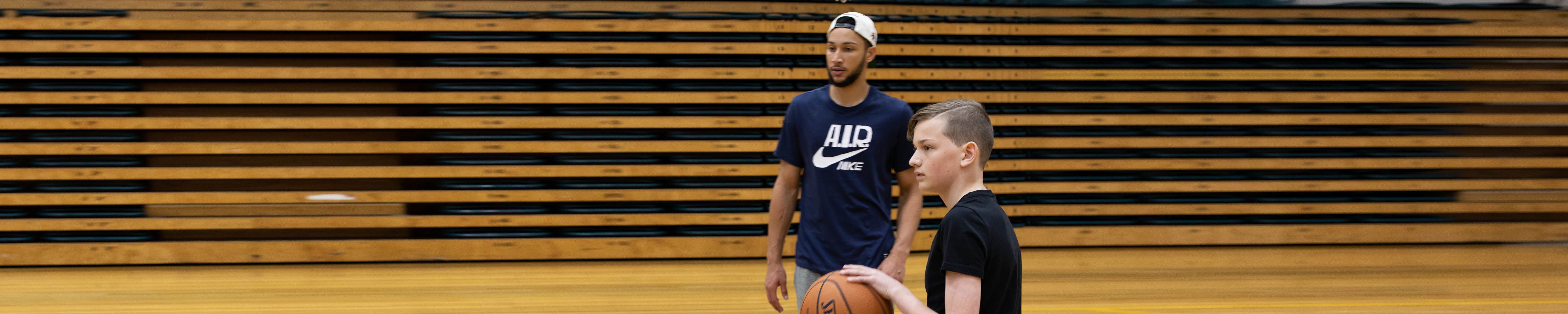 Make-A-Wish Australia wish kid Claude playing basketball with NBA star Ben Simmons