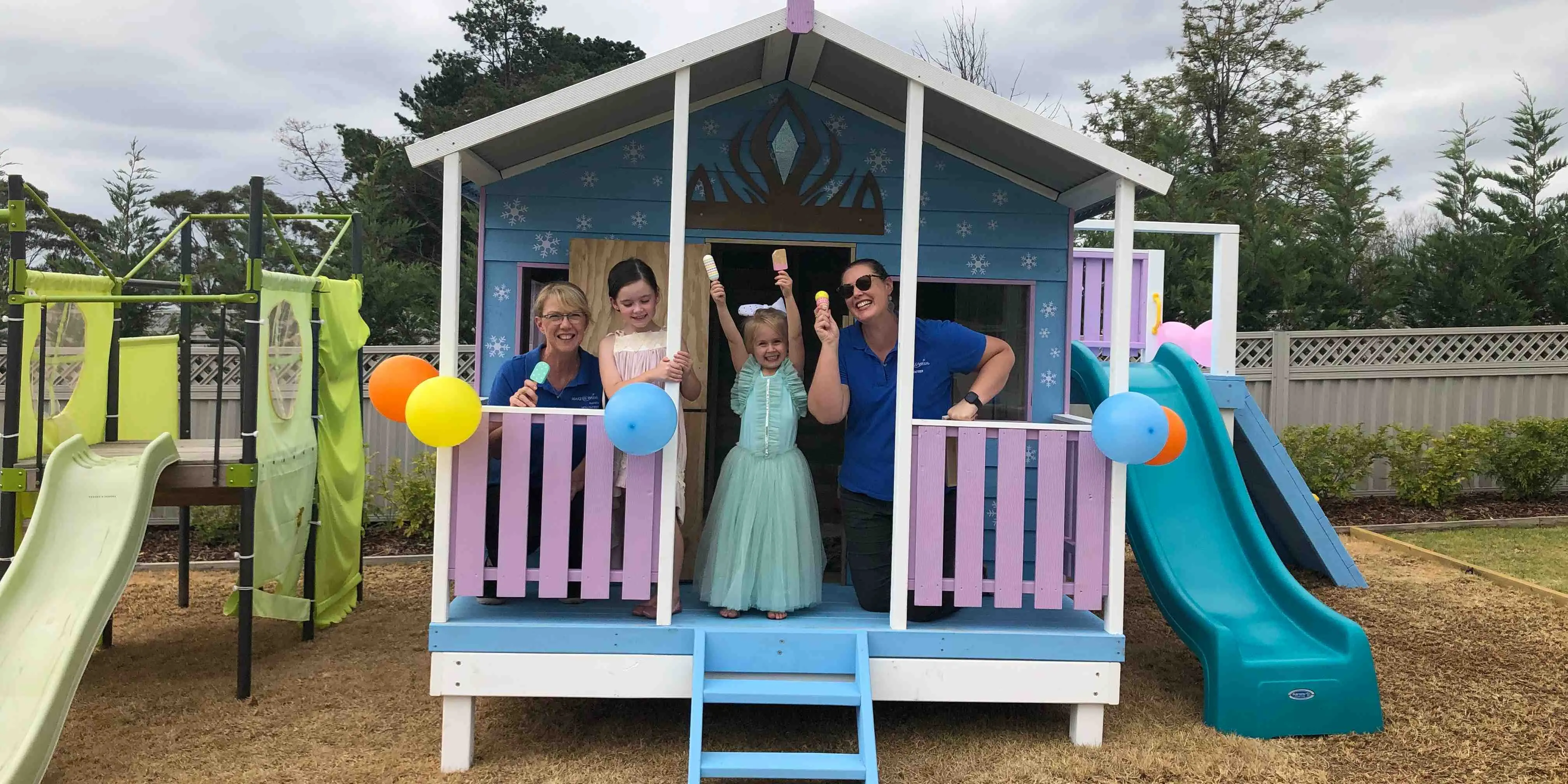 Make-A-Wish Australia wish kid Penelope celebrates in her new Frozen themed cubby house with volunteers