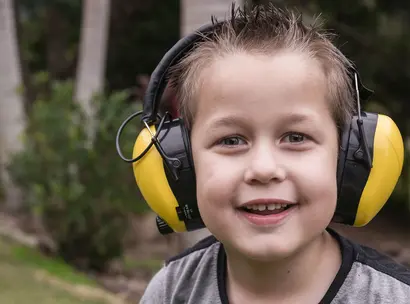 Make A Wish Australia Children's Charity - Bailey on his wish to get a mow mow like his pop wearing ear muffs