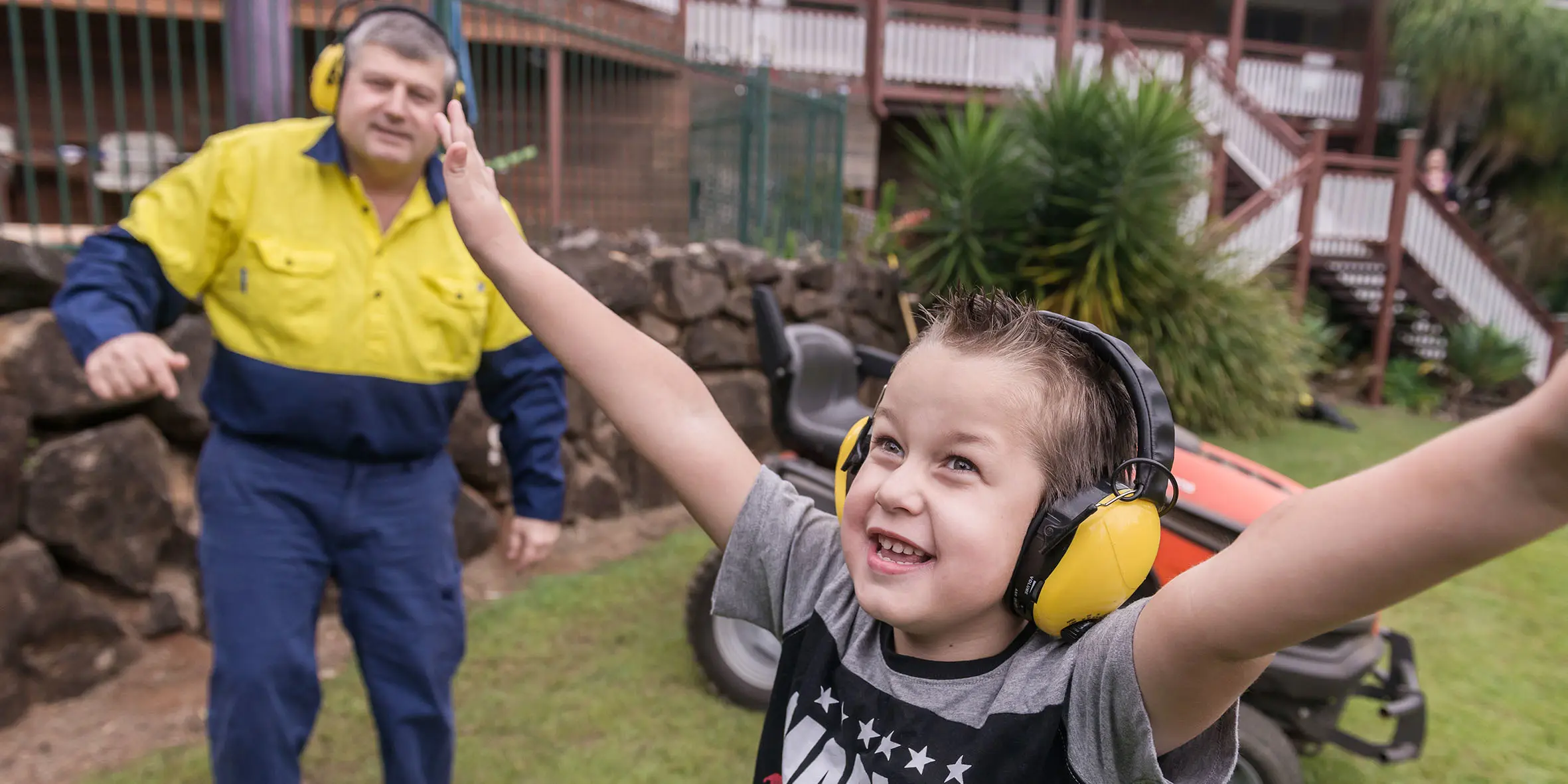 Make A Wish Australia Children's Charity - Bailey on his wish excited with his arms up in the air