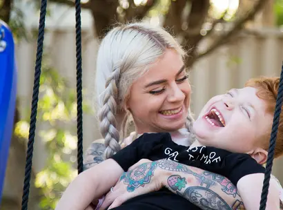 Make-A-Wish kid Levi with his mum on his swing