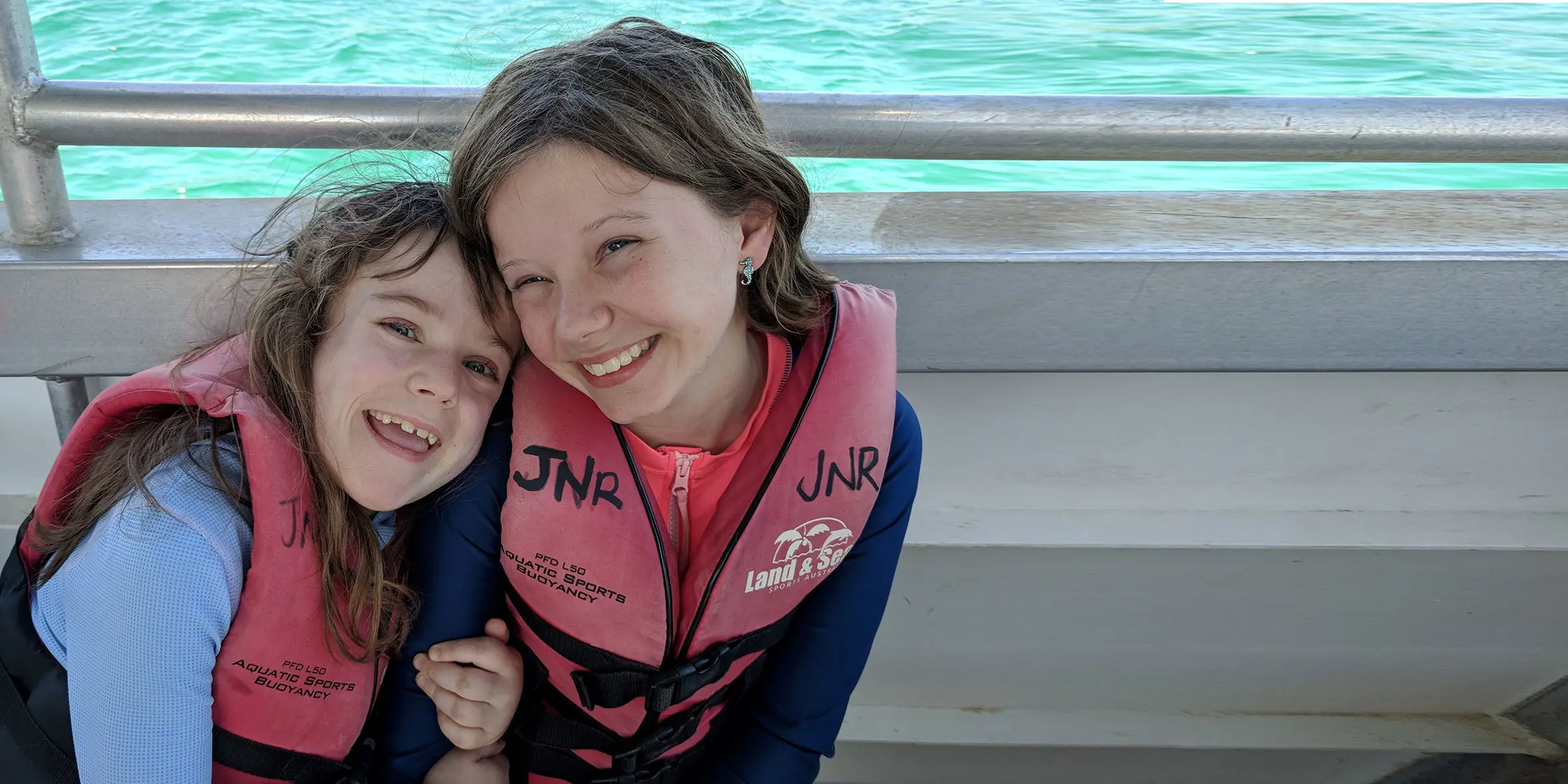 Make A Wish Australia Children's Charity - Freyja on her wish to meet the dugongs with her friend on a boat