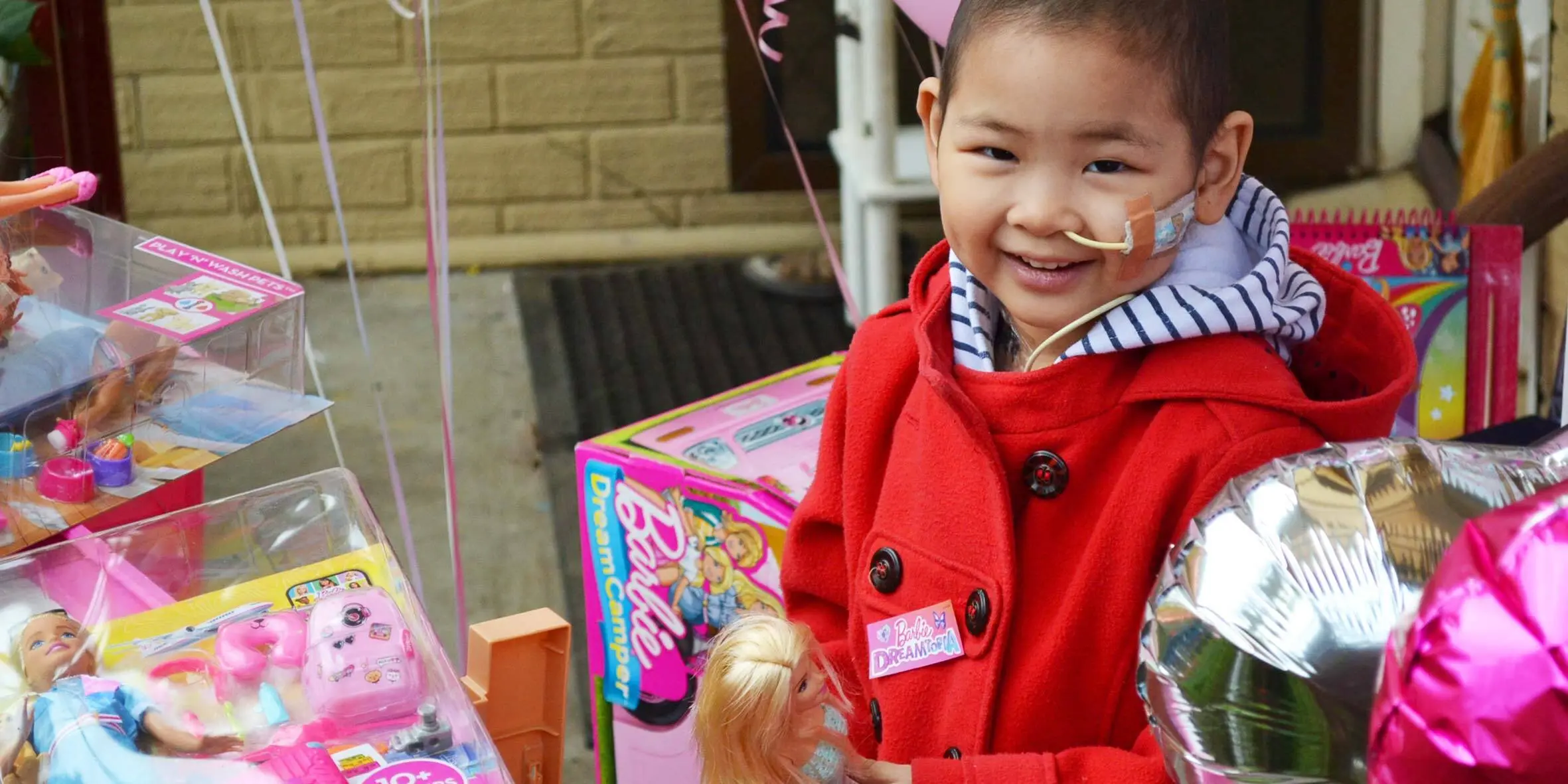 Kids Charity Make-A-Wish wish kid Maple with her Barbies