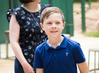 Make-A-Wish kid Henry, close up and smiling on his wish day to see animals