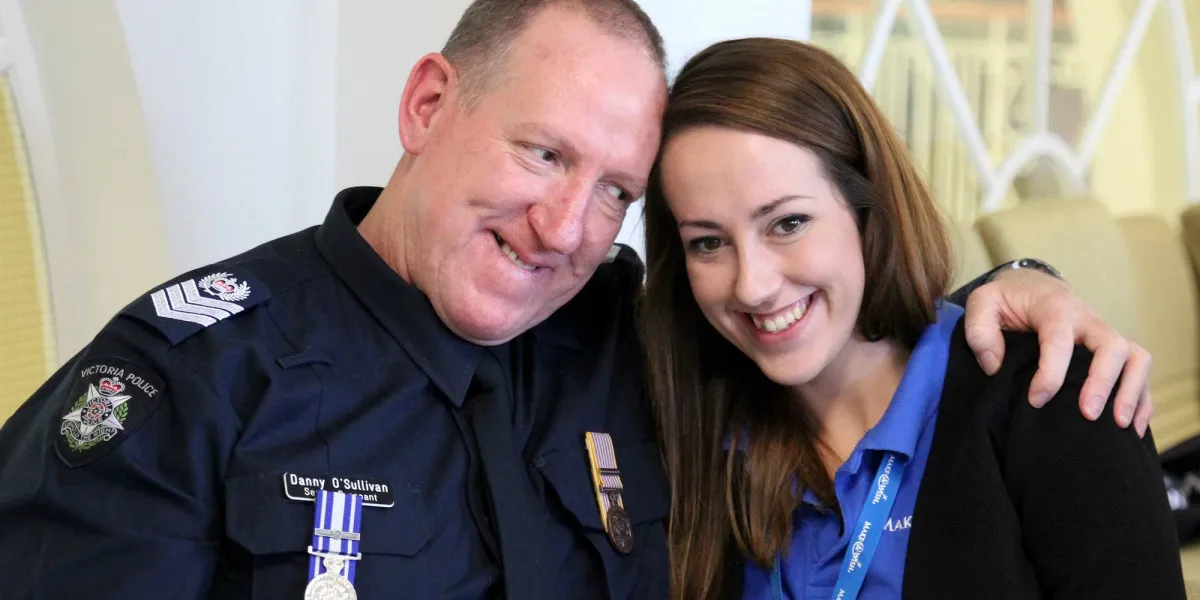 Make-A-Wish Australia volunteer with a police officer