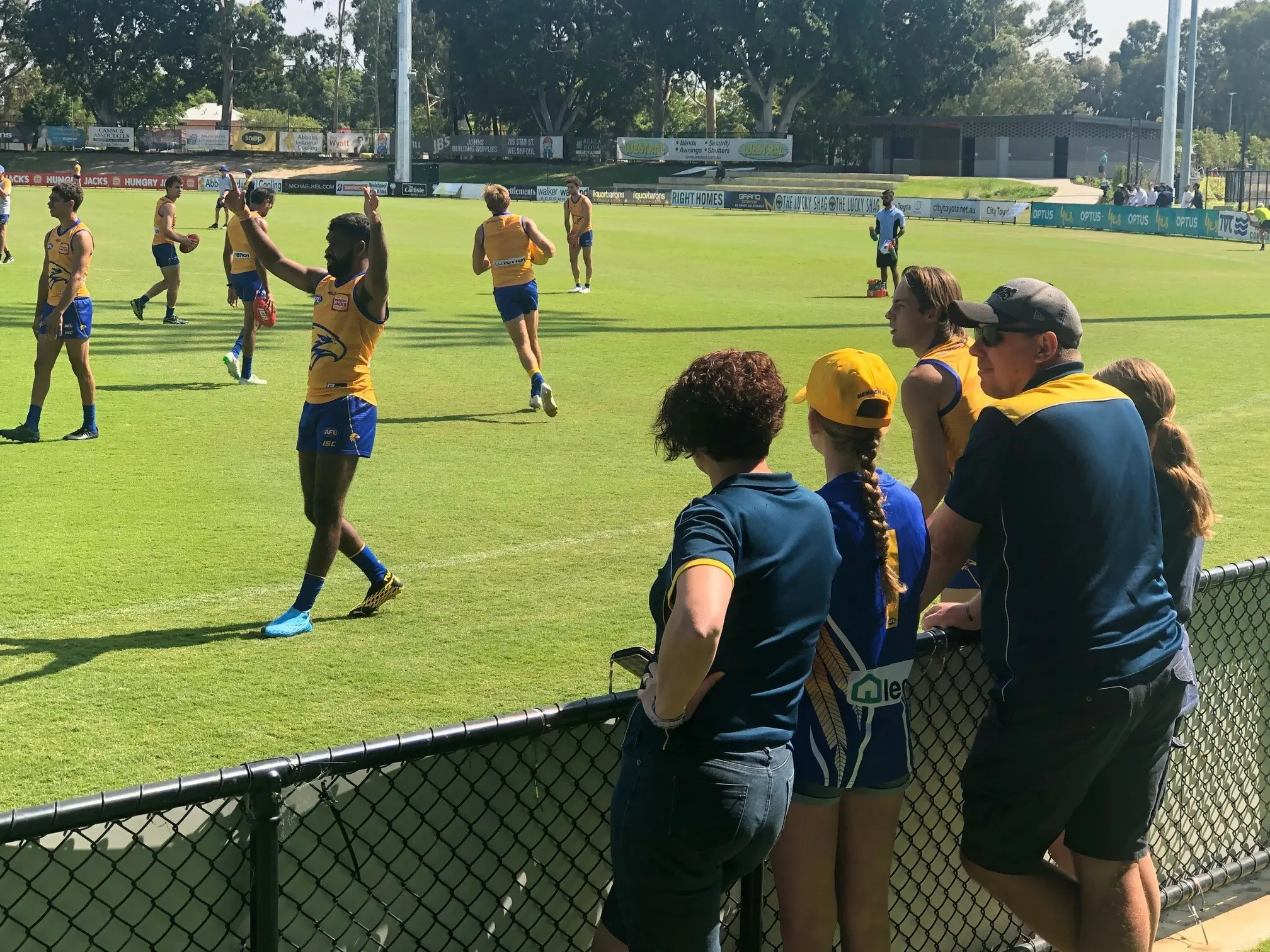 Make-A-Wish wish kid Jacinta and family watching West Coast Eagles train