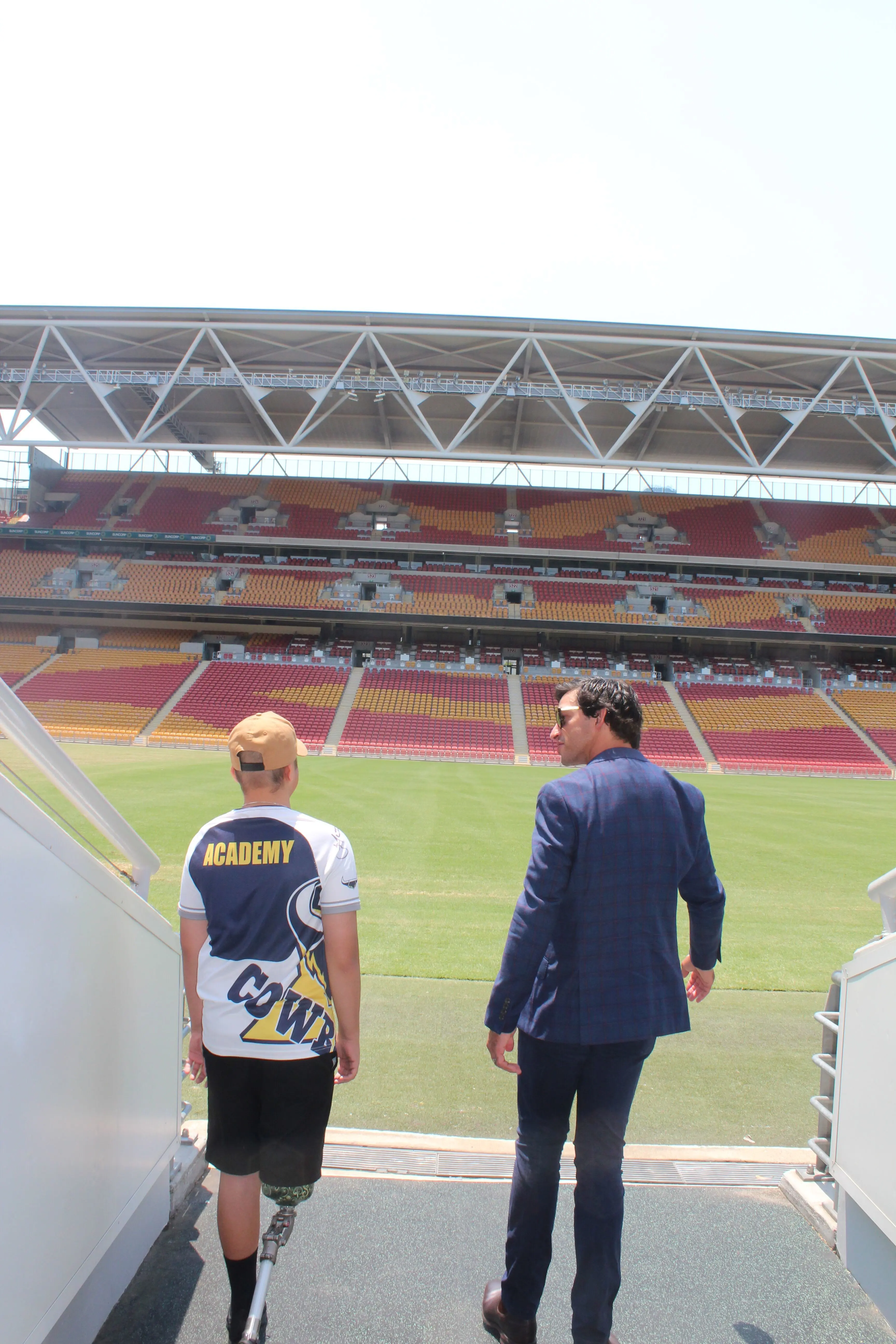 Brodi and Johnathan Thurston walking onto the field