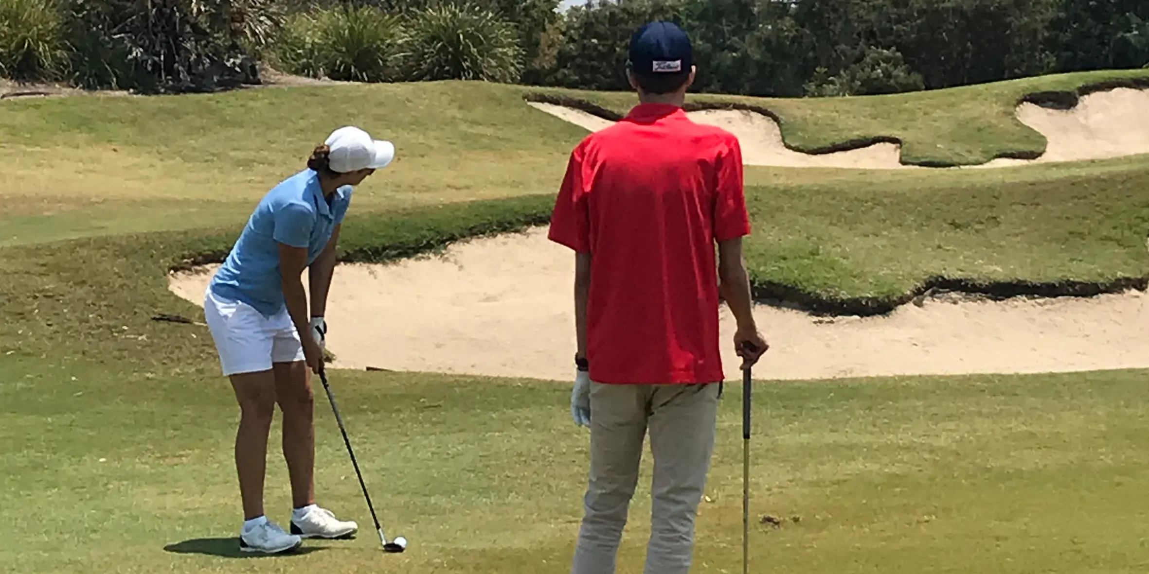 Make-A-Wish Australia wish kid George playing golf with tennis star Ash Barty