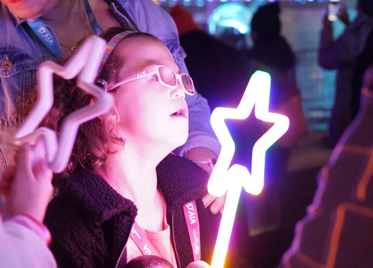 Make-A-Wish Australia wish kid Hannah lying on grass