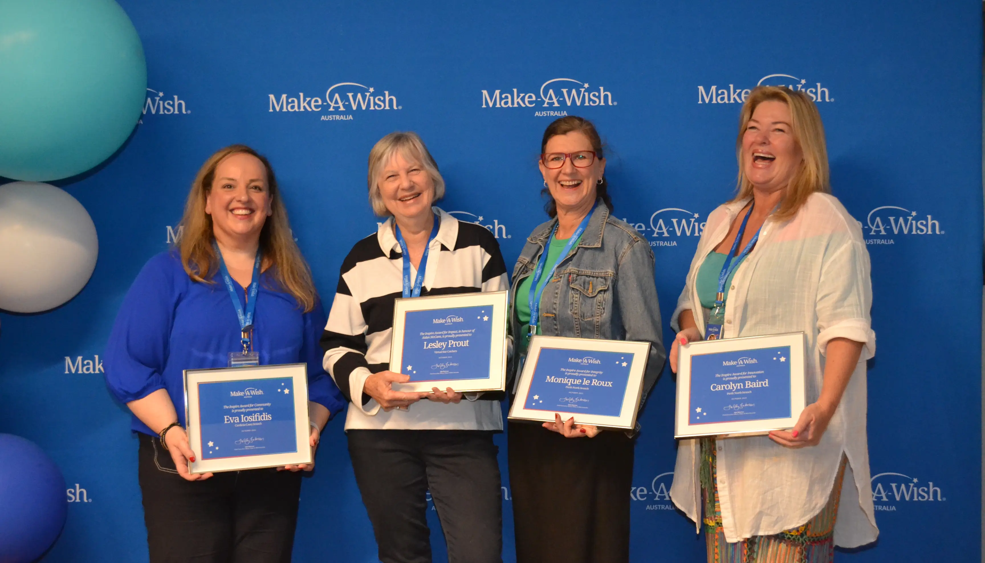 Make A Wish Australia Children's Charity - Hall of fame volunteer winner 2018 Emma standing with her certificate