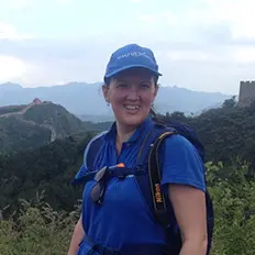 Make A Wish Australia Children's Charity - Volunteer Michelle wearing a Make A Wish t-shirt and hat